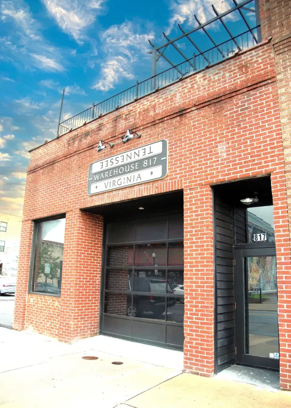 Warehouse 817 brick storefront on a clear day