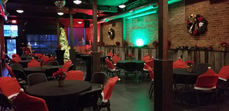 Christmas-decorated event space with festive lighting