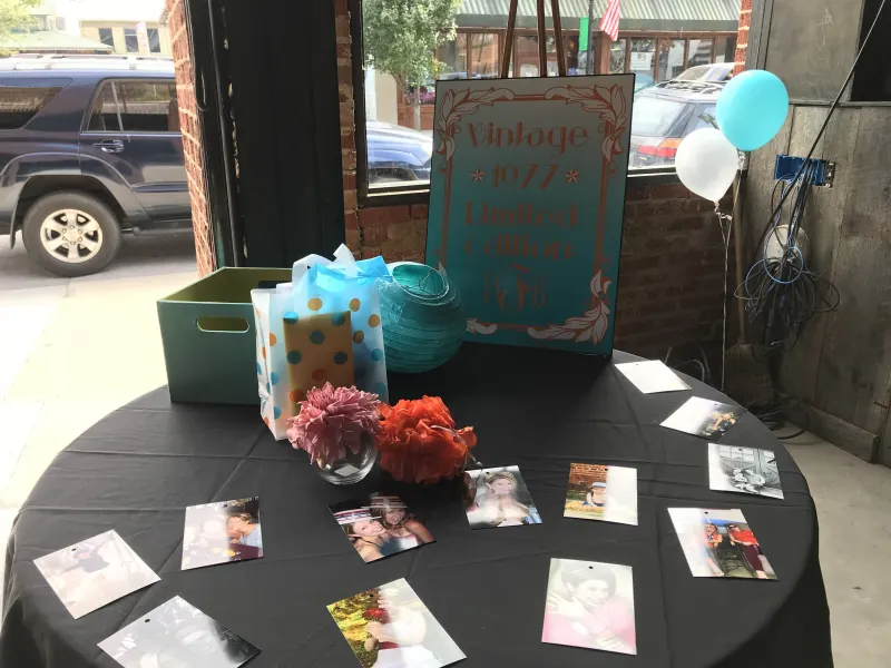 Birthday party welcome table with balloons and decorations