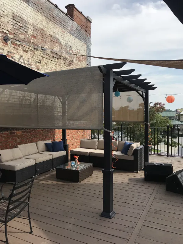 Rooftop lounge seating under the pergola