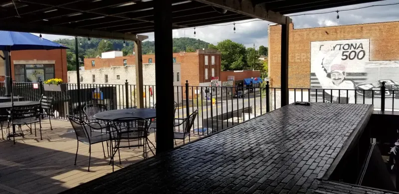 Rooftop patio with a view of the Daytona 500 mural