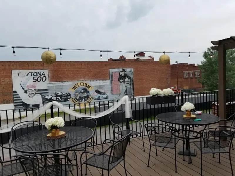 Rooftop cocktail tables with white hydrangea centerpieces