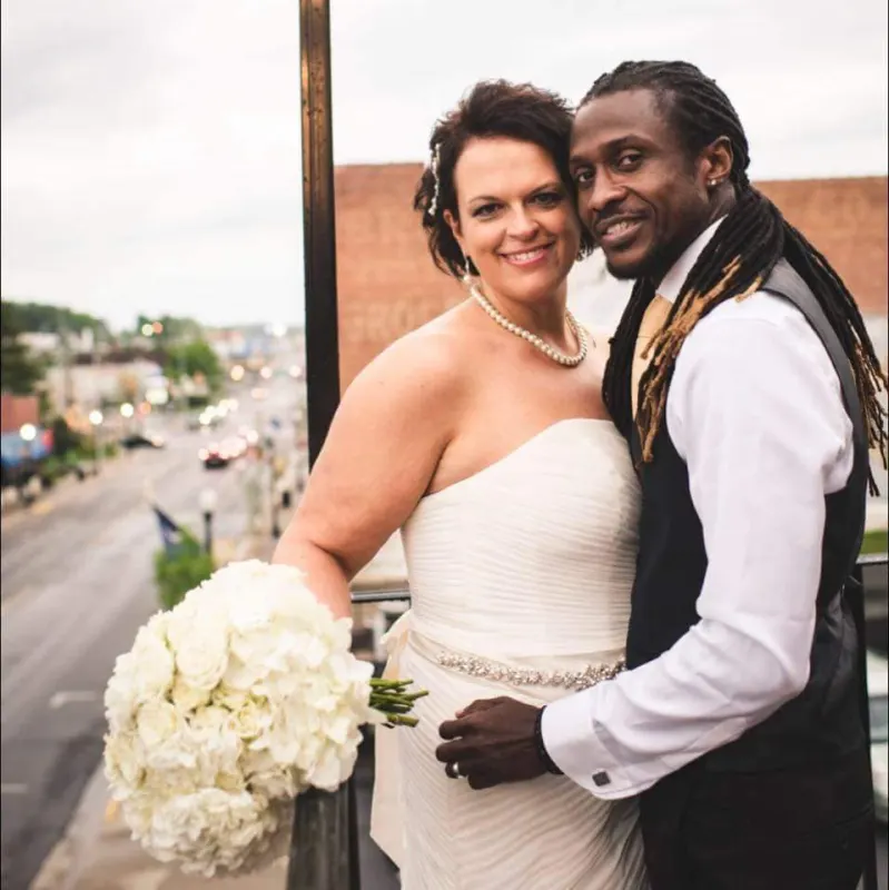 Bride and groom on the balcony above downtown Bristol