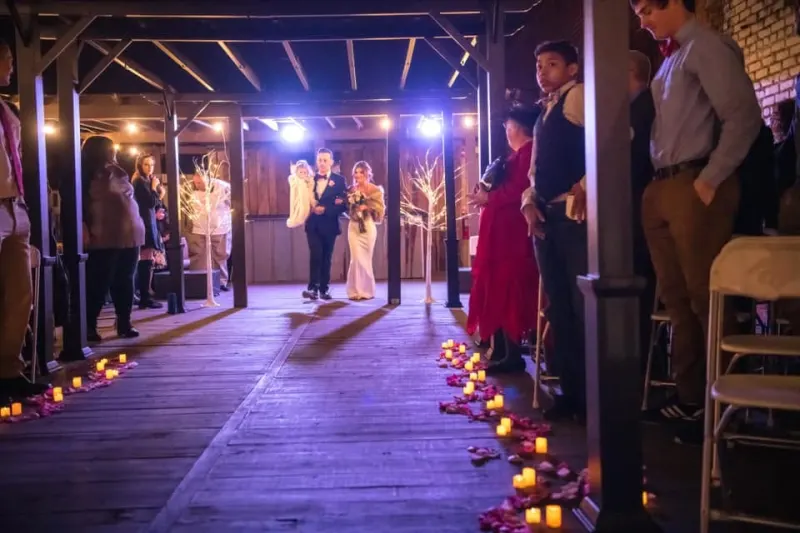 Candlelit indoor wedding processional